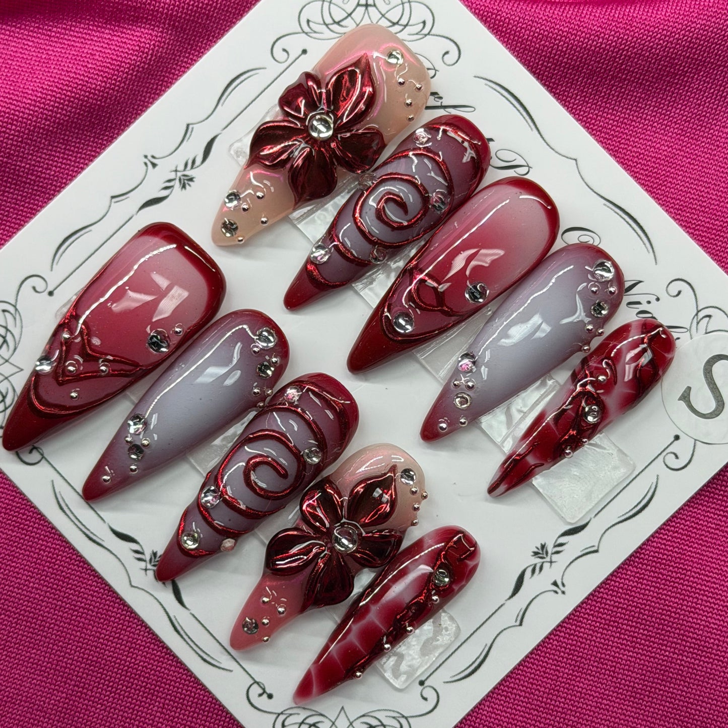Maroon floral swirl