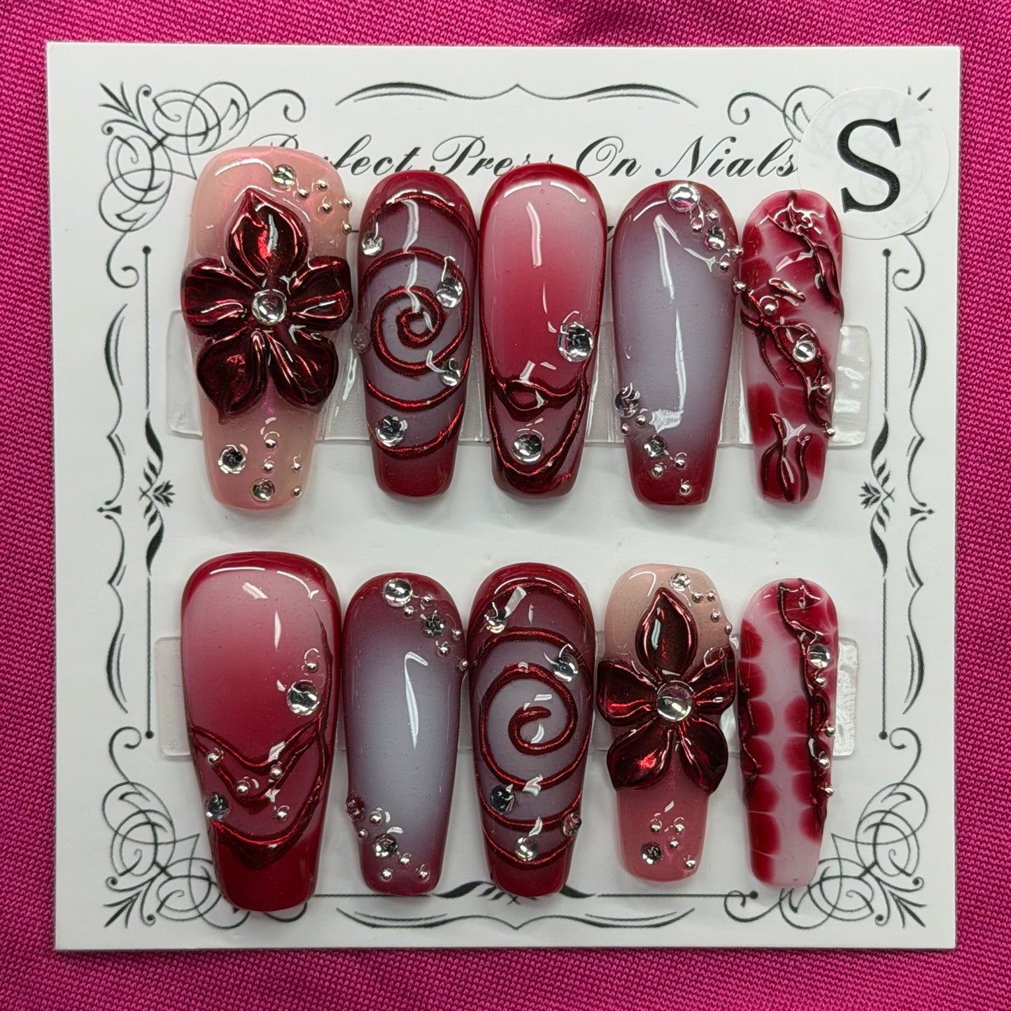 Maroon floral swirl