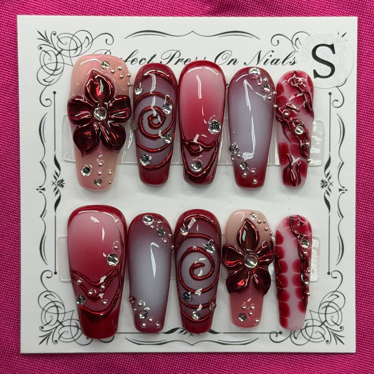 Maroon floral swirl