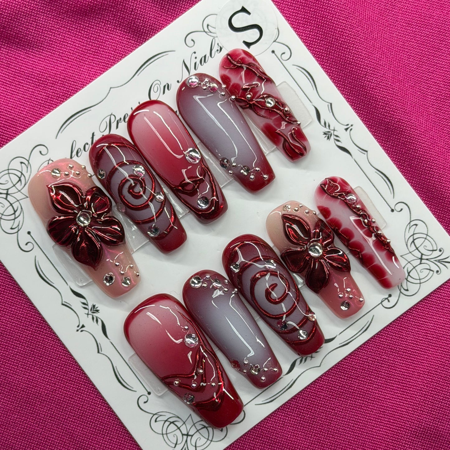 Maroon floral swirl